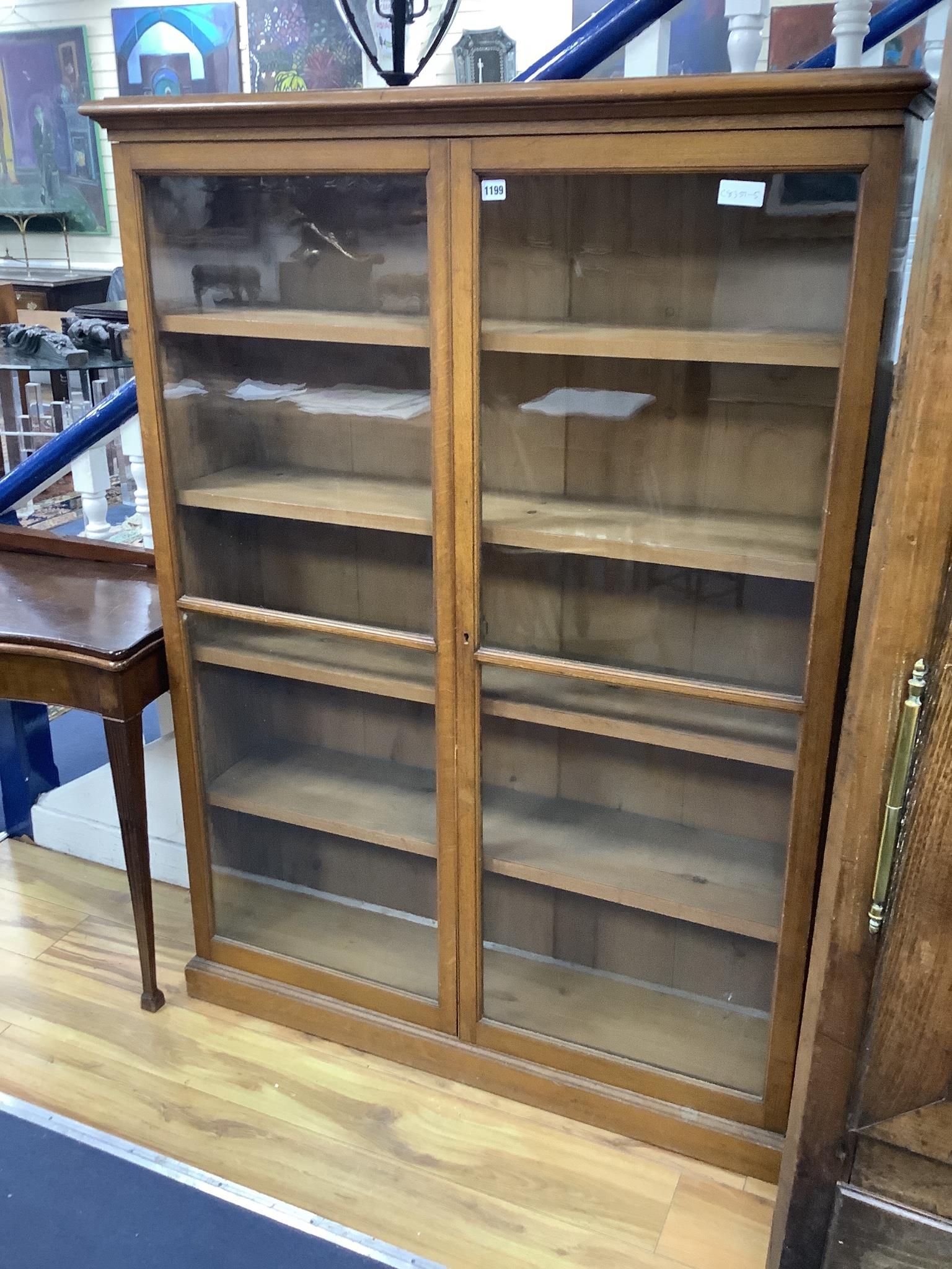 A late Victorian oak two door glazed bookcase